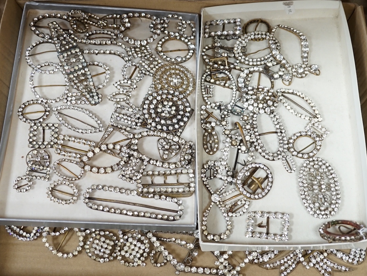 A large quantity of assorted white paste set buckles and brooches.